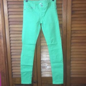 Bright green skinny jeans
